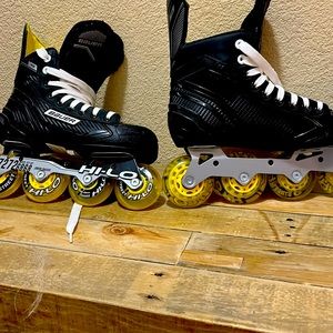 Boys Bauer in-line skates. Used for about two weeks. Great condition